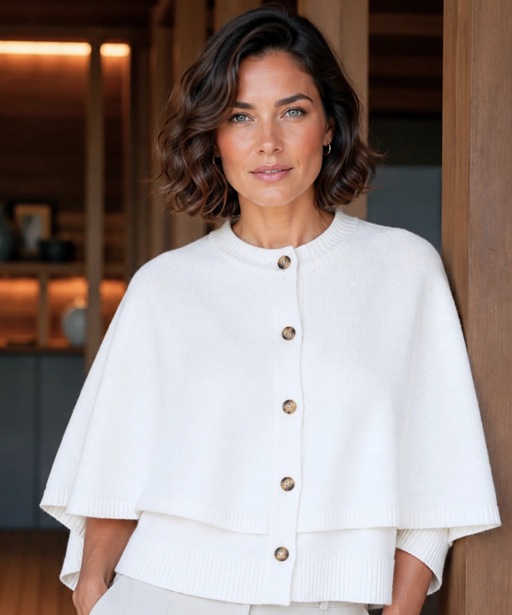 Women's cashmere-soft sweater cape in ivory with button front, front view