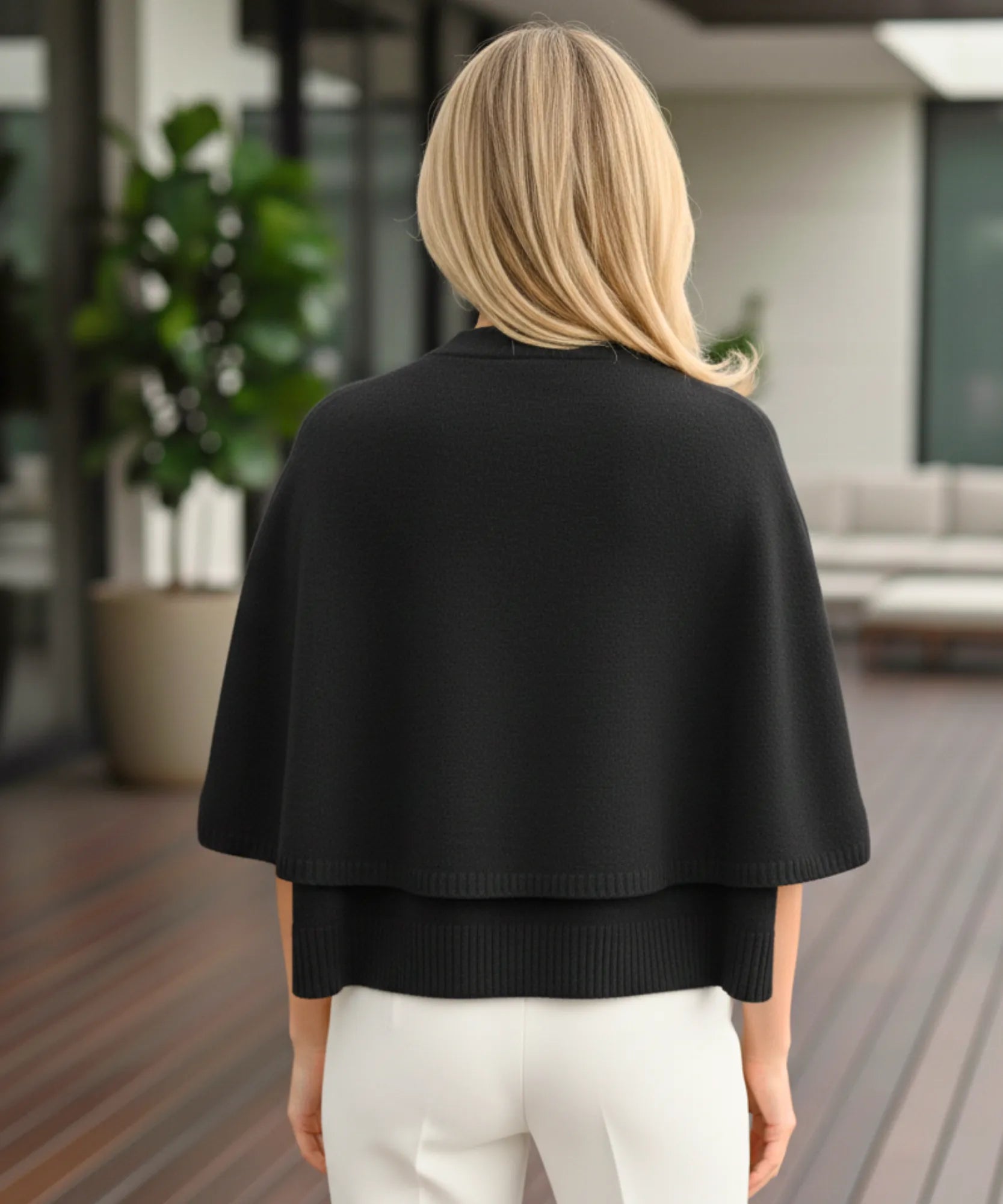 Women's cashmere-soft sweater cape in black, back view
