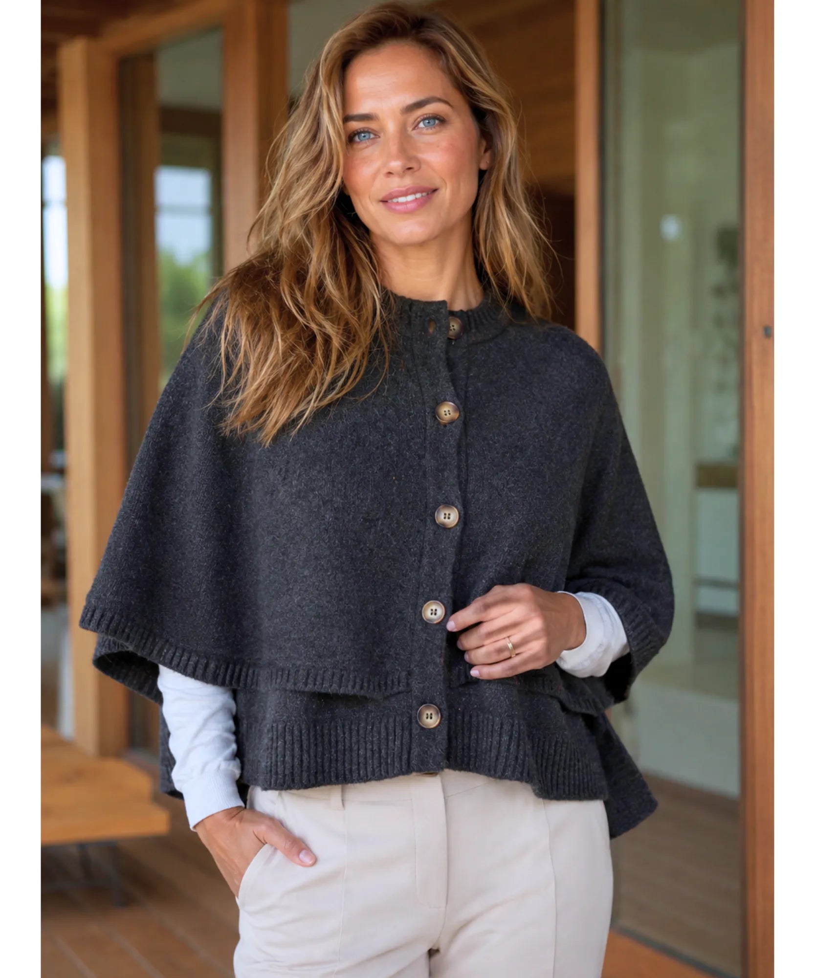 Women's cashmere-soft sweater cape in grey with button front, close-up view