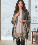 Women's aztec print ruana wrap in grey with fringe hem, styled with hat