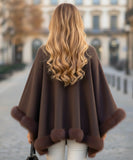 Women's chocolate turtleneck poncho with fur trim, side view