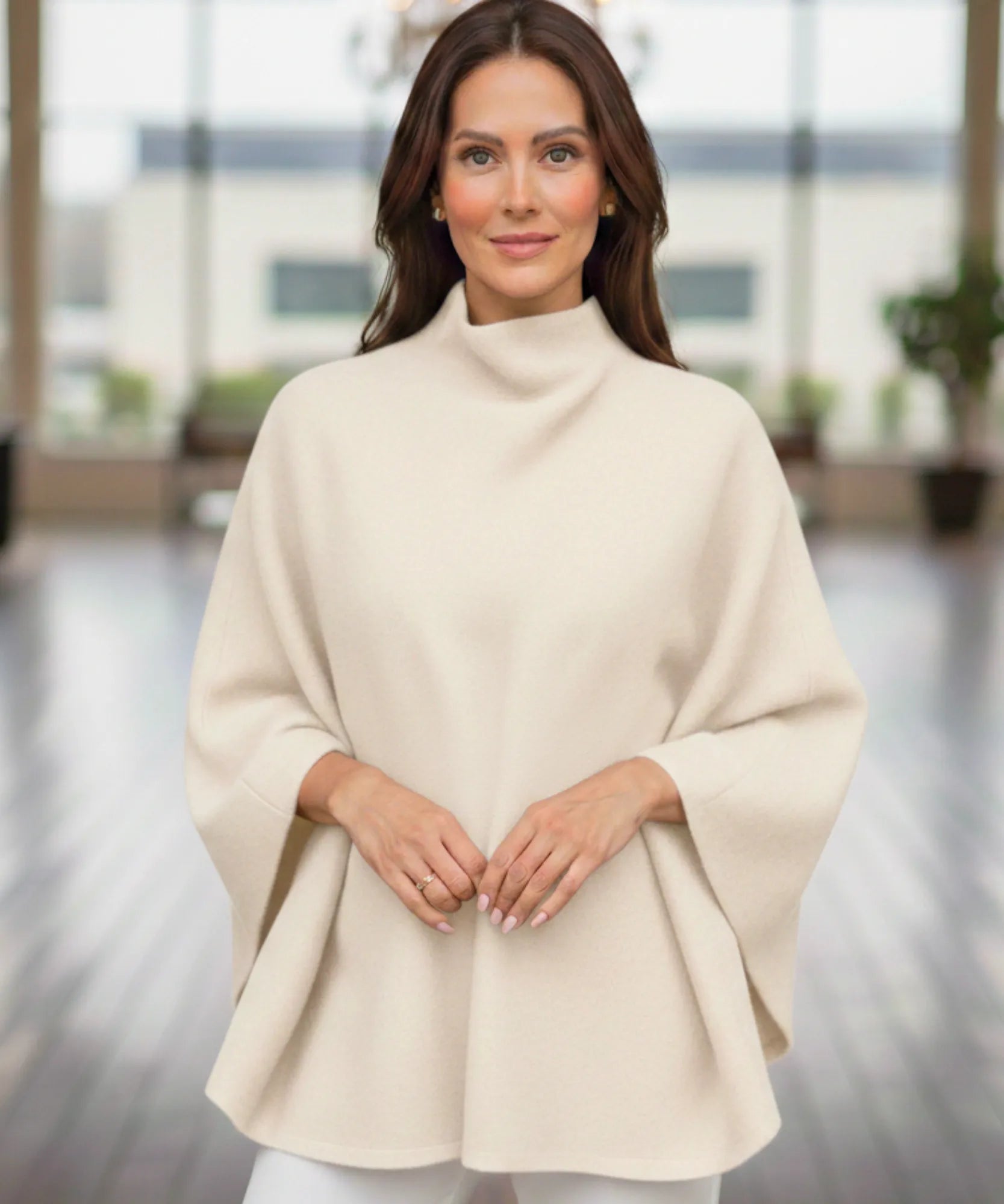 Women's ivory mock-neck sweater poncho, front view