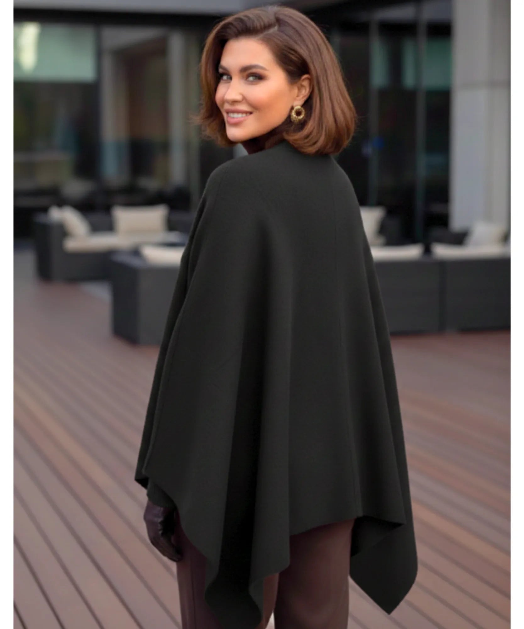Women's black mock-neck sweater poncho, styled look