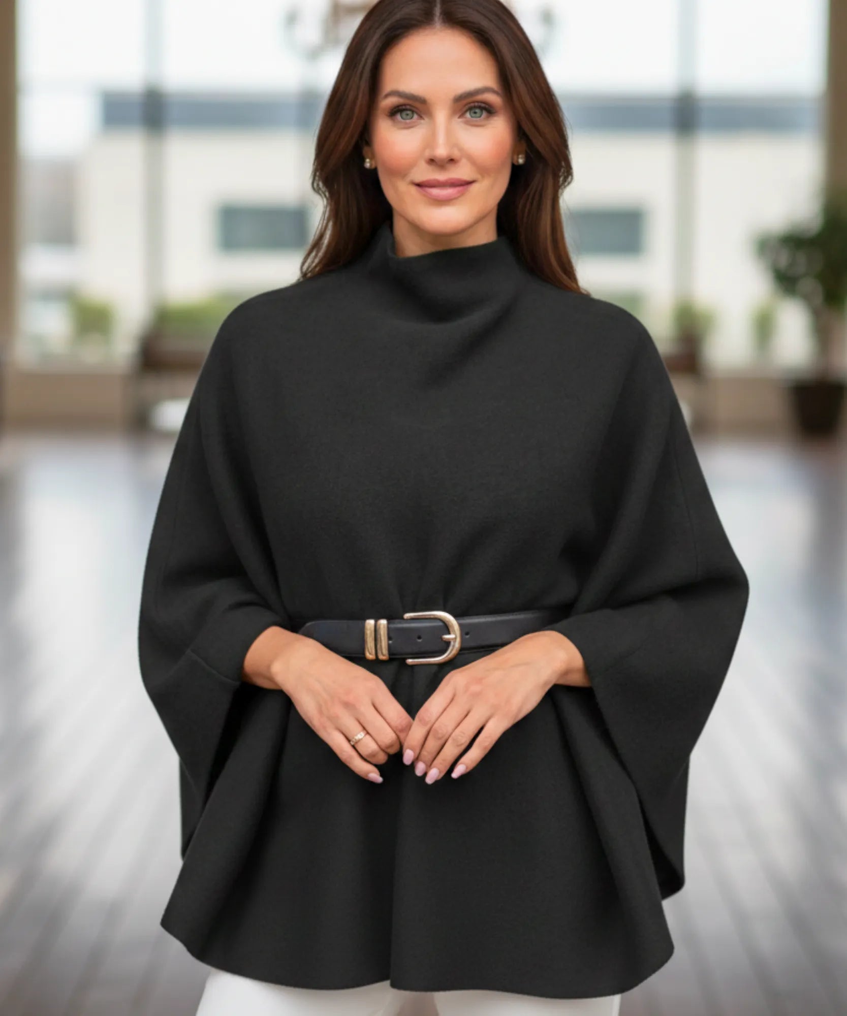 Women's black mock-neck sweater poncho, front view
