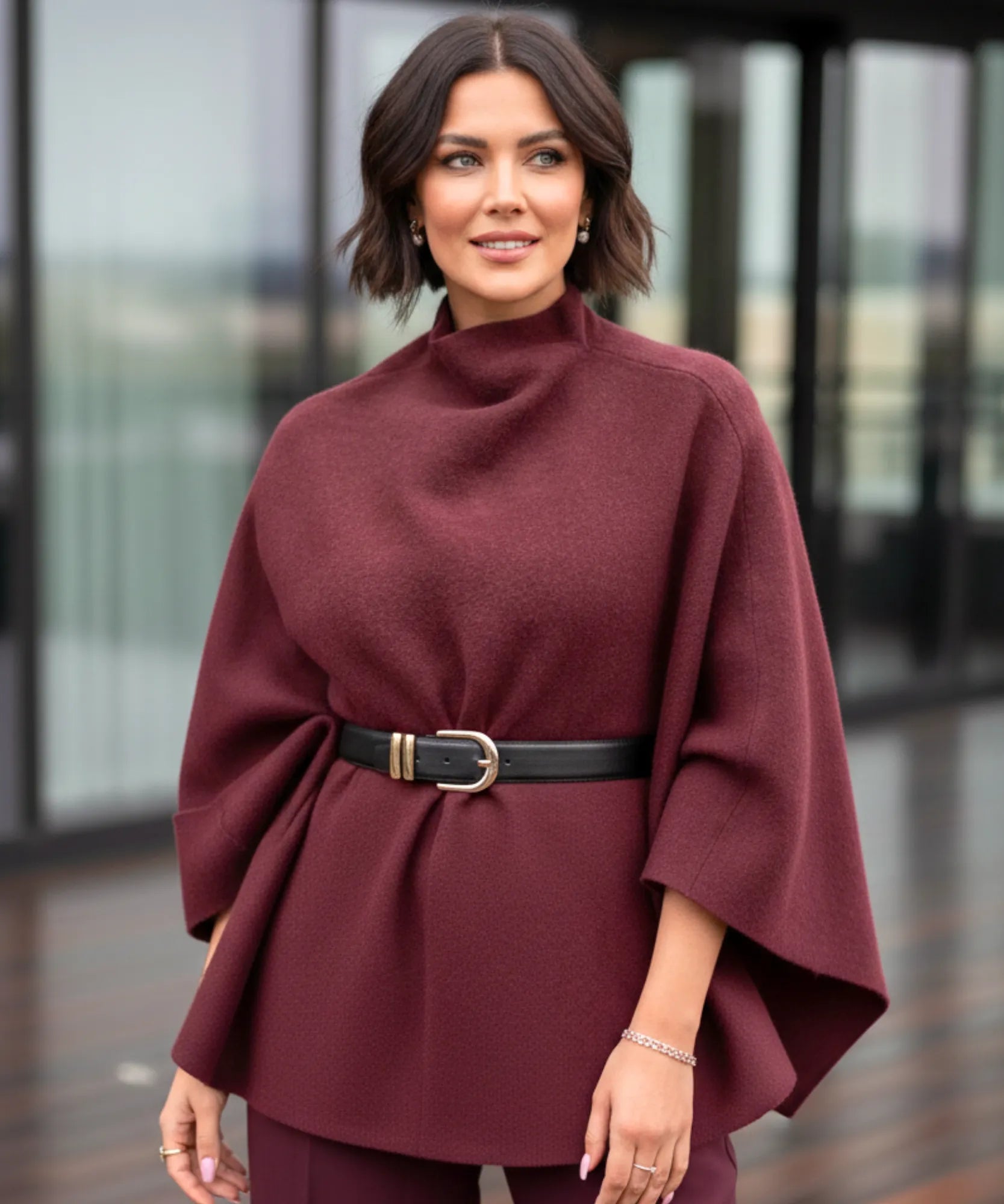 Women's burgundy mock-neck sweater poncho, styled look