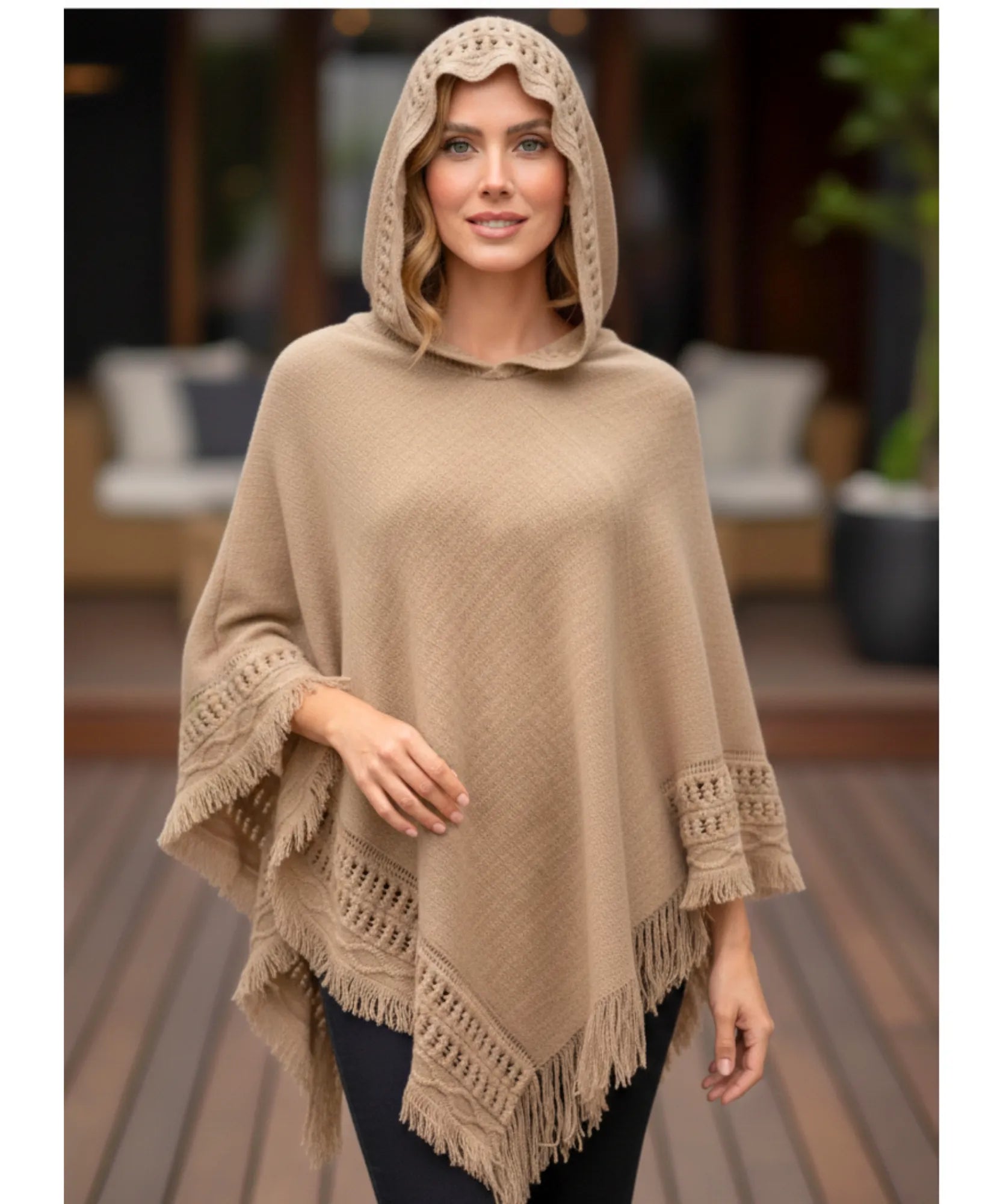 Women's hooded poncho sweater in camel chunky knit, hood up, front view