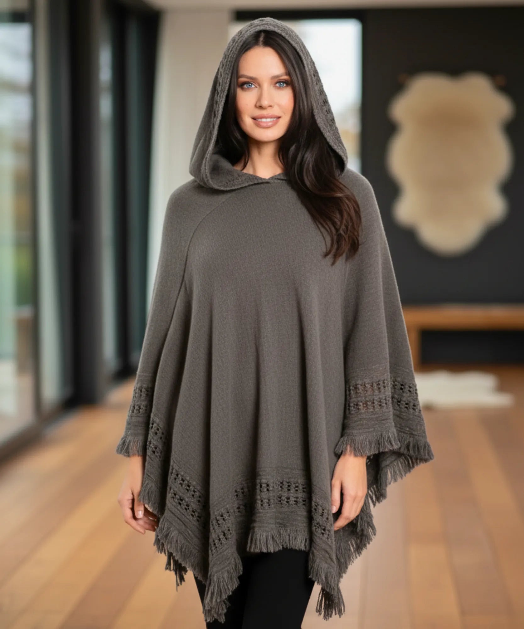 Women's hooded poncho sweater in grey chunky knit, front view