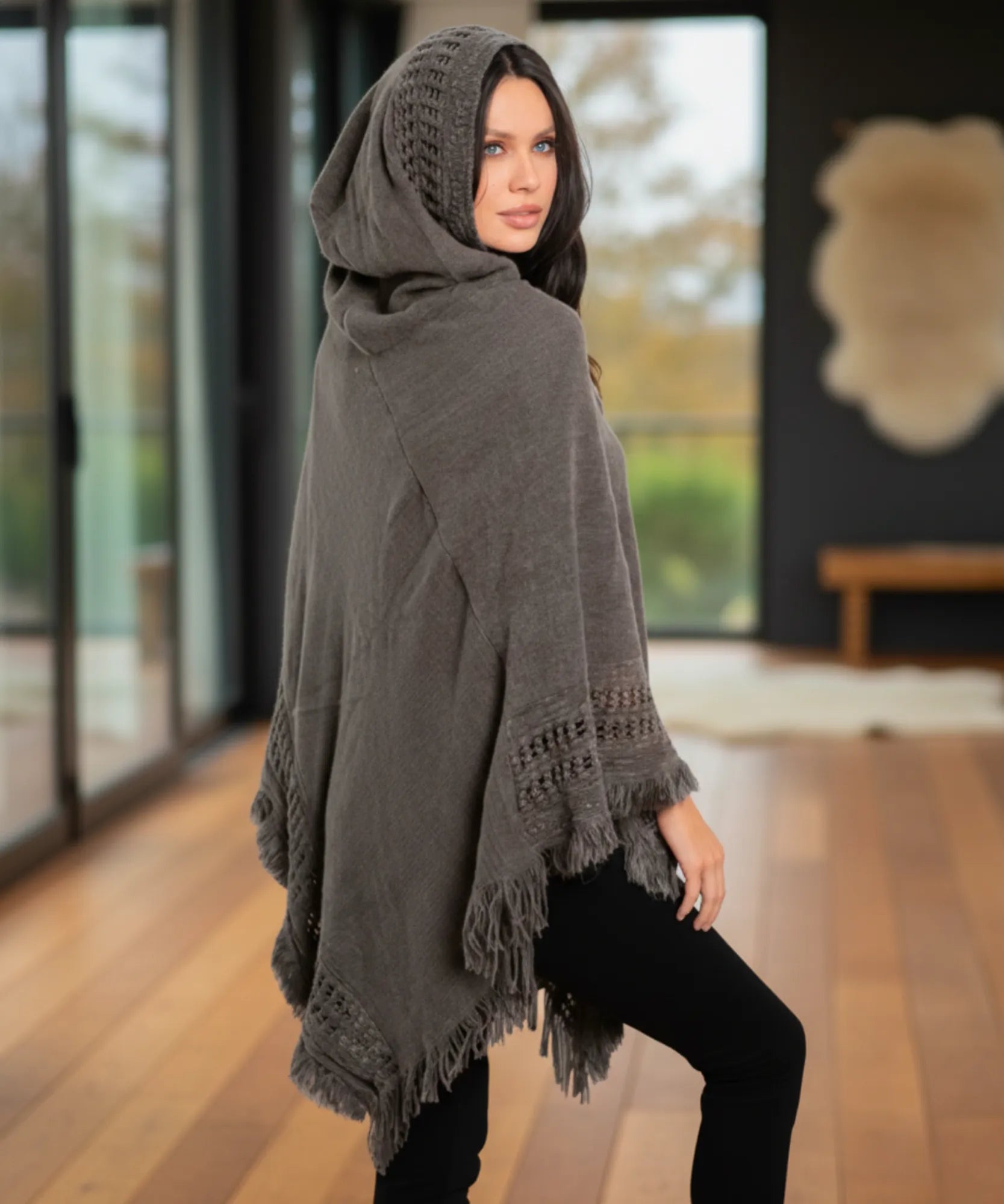 Women's hooded poncho sweater in grey chunky knit, full-length front view