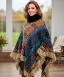 Women's boho poncho sweater in rainbow multicolor chunky knit with fur-trim collar and fringe hem