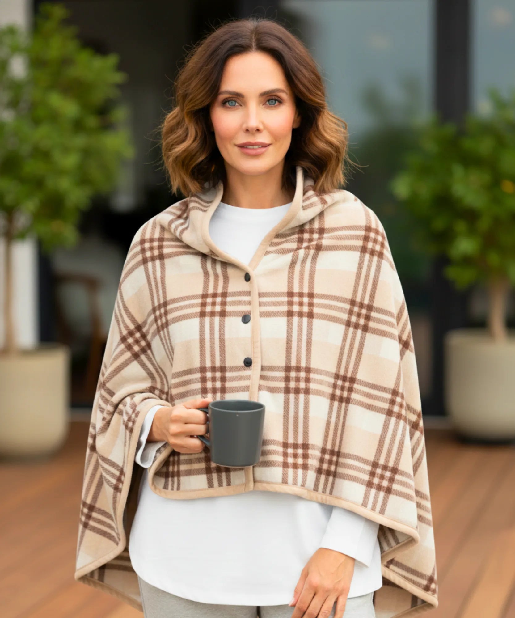 Women's plaid blanket poncho in beige plaid with hood and button front