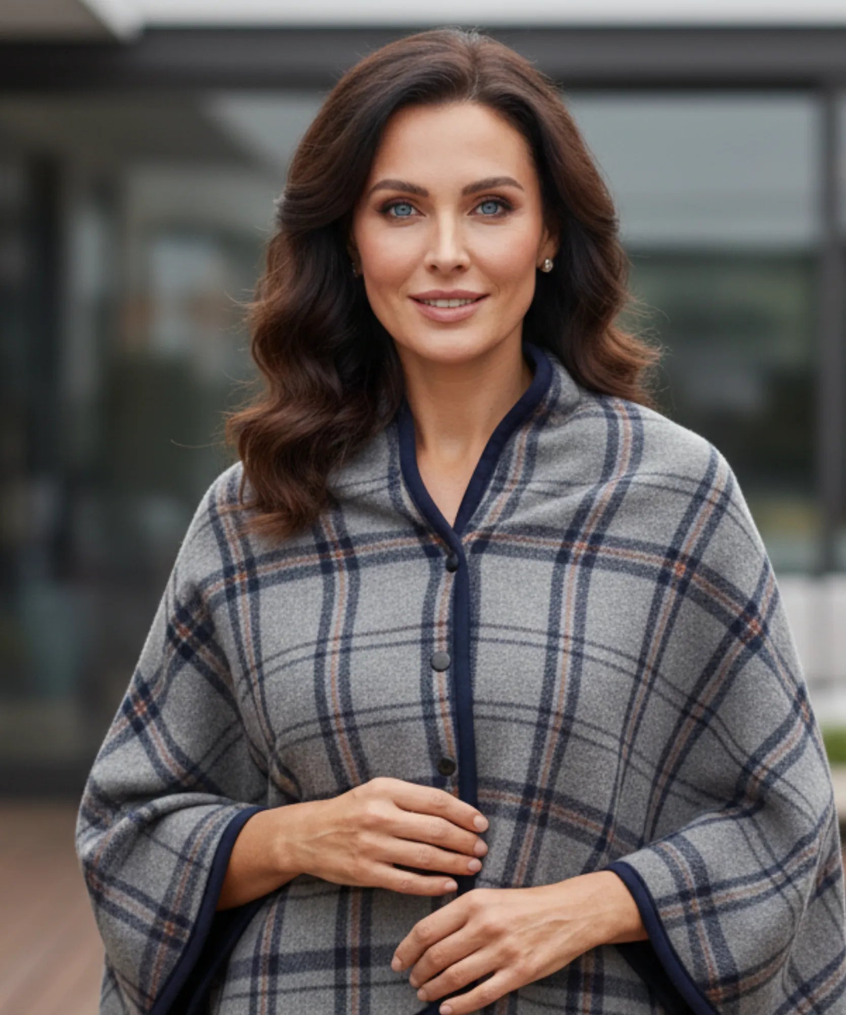 Women's plaid blanket poncho in charcoal plaid with button front