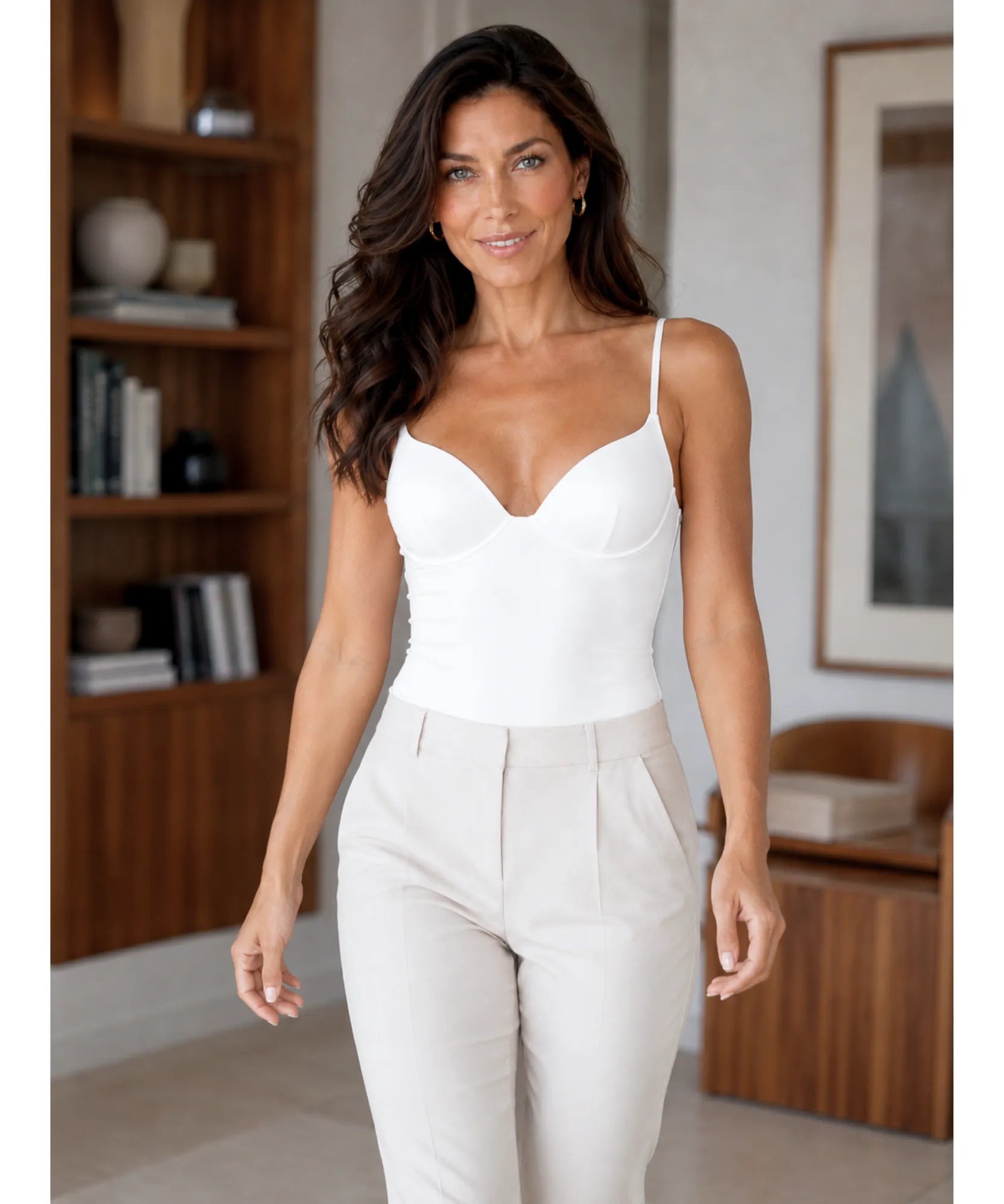 Full-length view of a white bustier top with ivory trousers