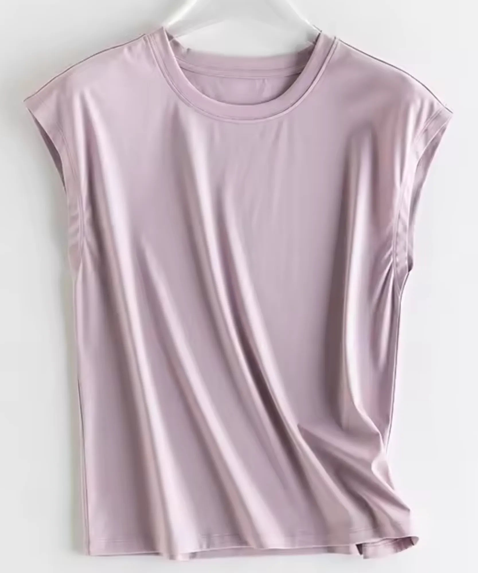 Women's cap sleeve top in mauve on a hanger