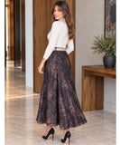 Women's brown marble print midi skirt, side view with a cream top
