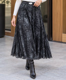 Women's black marble print midi skirt styled with boots