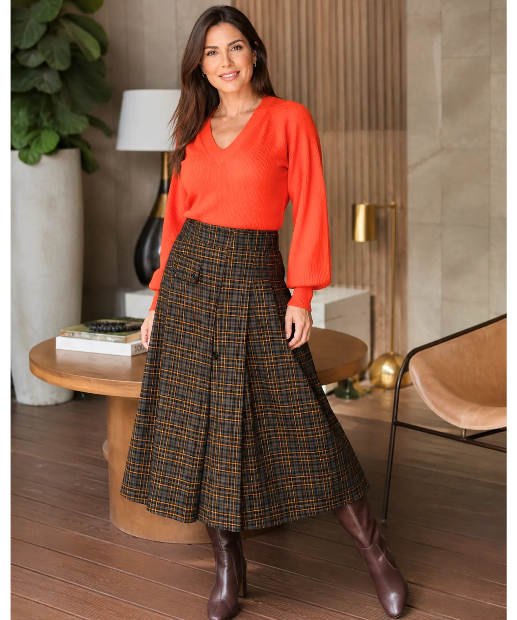 Close-up of brown plaid pattern on women's midi skirt