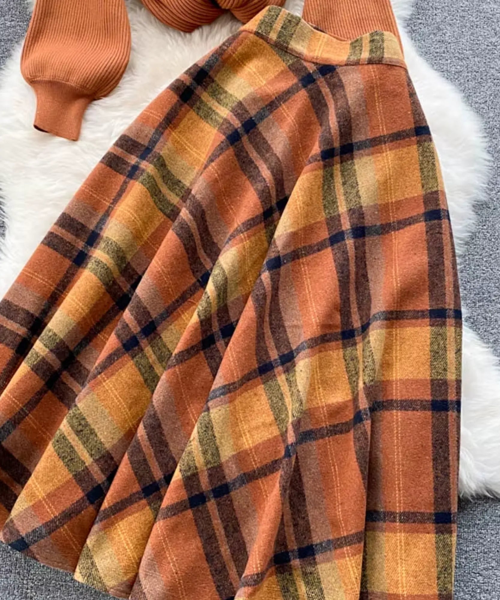 Women's terracotta wool plaid midi skirt, side profile