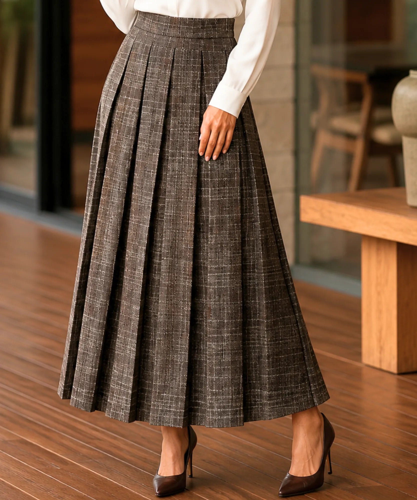 Women's brown plaid pleated wool midi skirt, movement and pleat detail