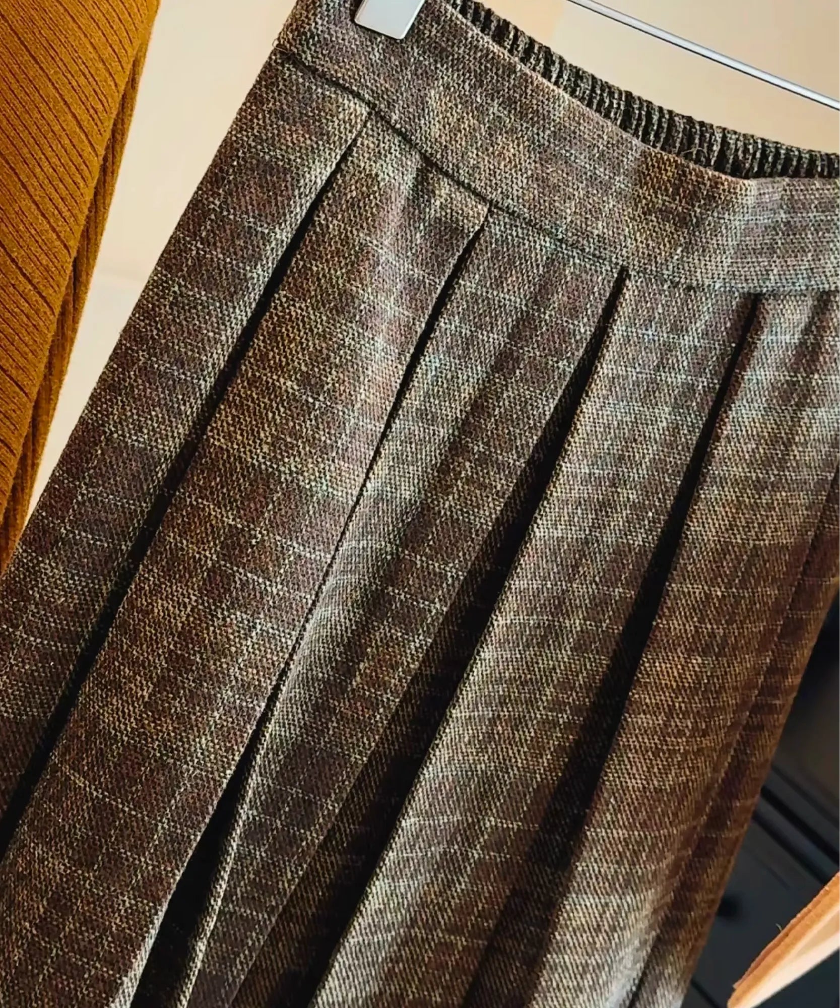 Women's brown plaid pleated wool midi skirt, back view