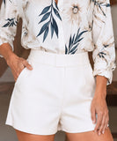 Women's white high waisted dress shorts front view