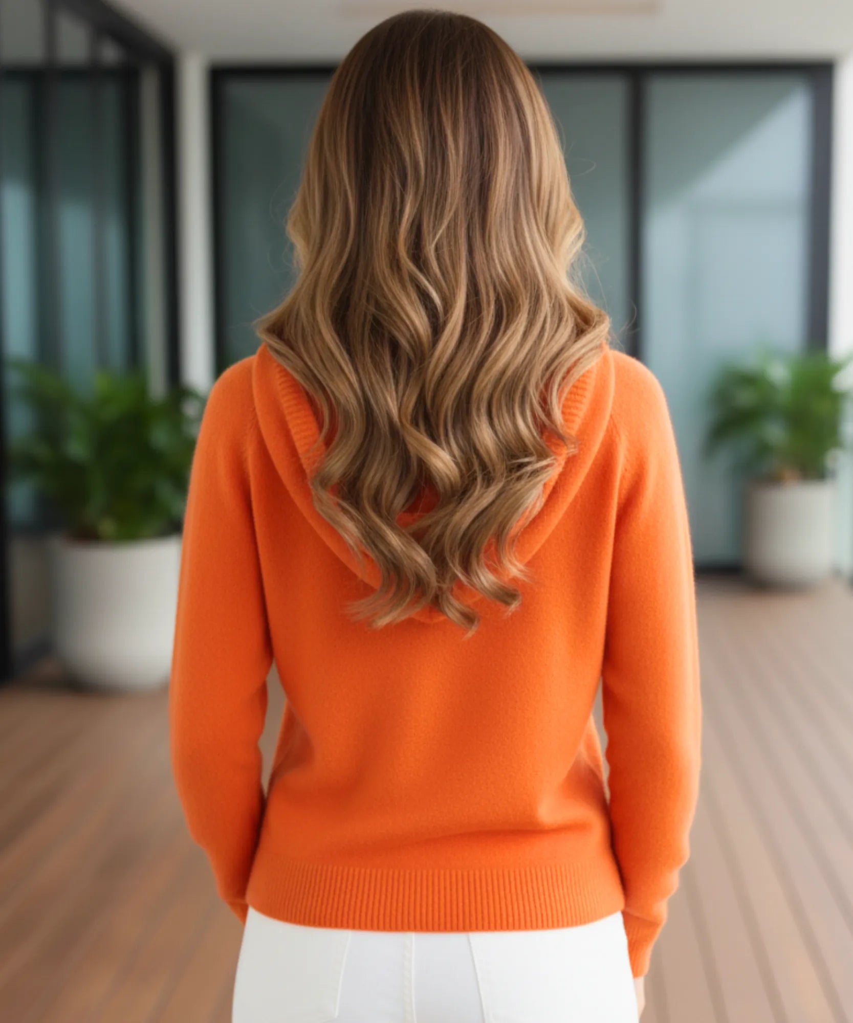 Women's Oversized Hooded Knit Sweater in Orange, a soft drawstring-hood knit for winter, back view