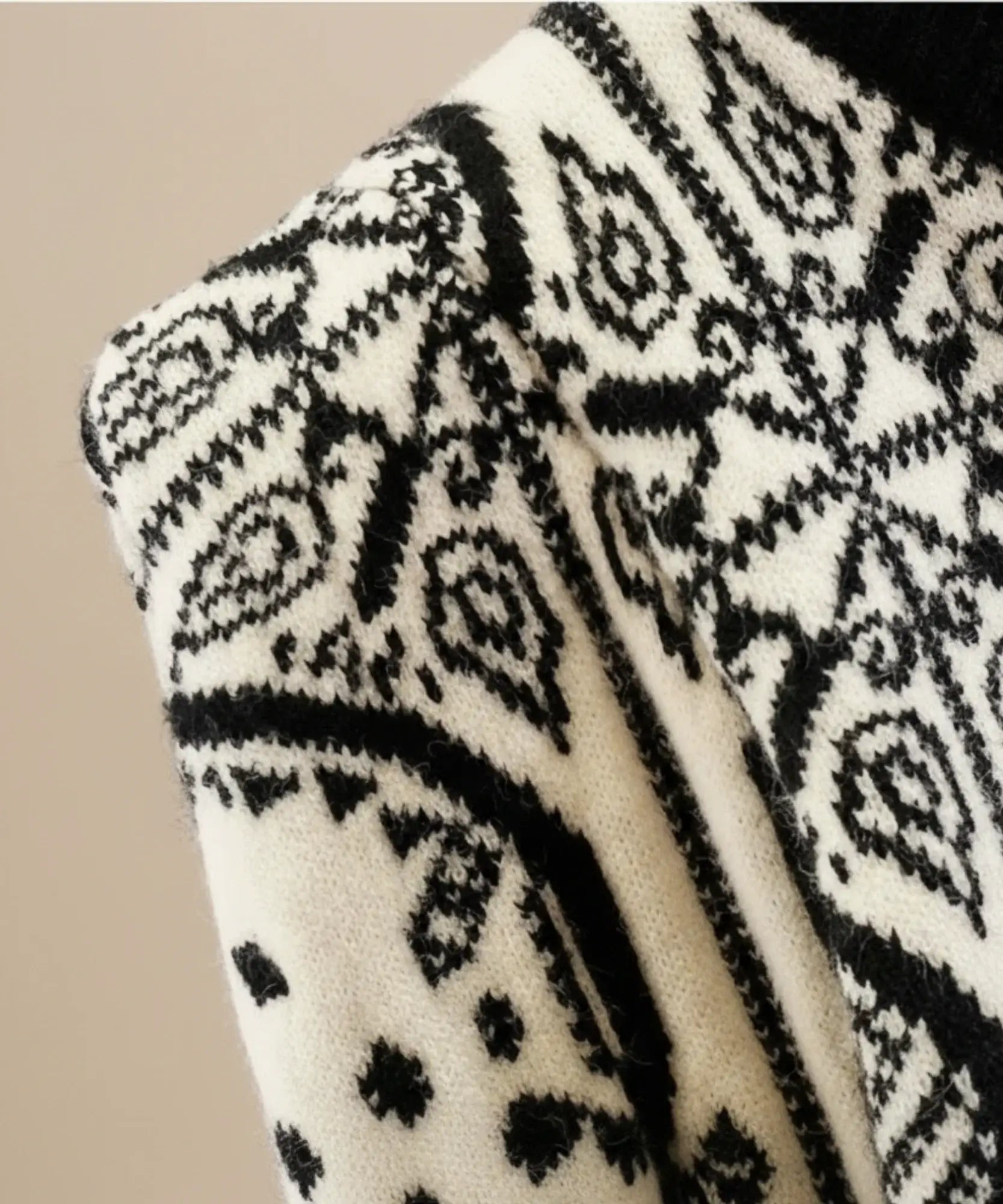 Women's Black and White Jacquard Turtleneck Sweater, detail view of the ribbed cuff