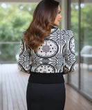 Women's Black and White Jacquard Turtleneck Sweater, close-up of the ribbed turtleneck and cuffs