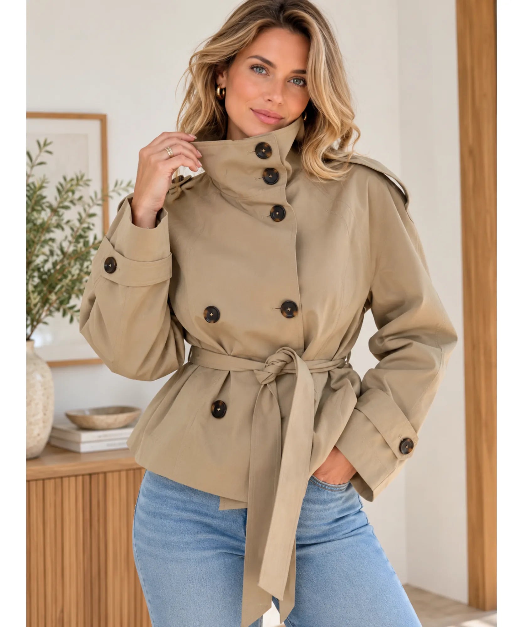 Women's short trench coat in khaki with belt, styled with jeans
