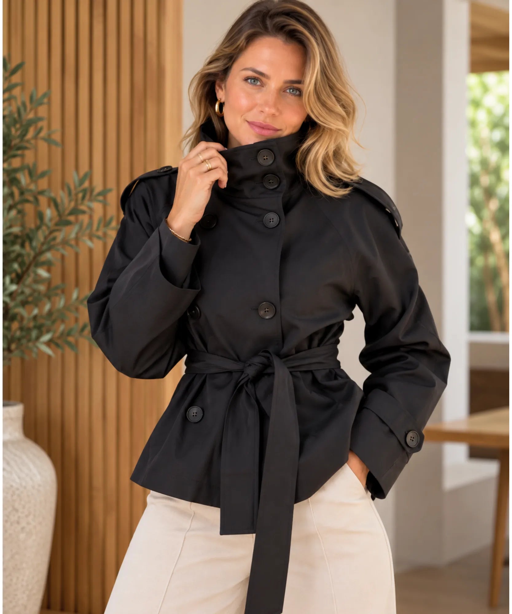 Women's short trench coat in black with funnel neck and belt