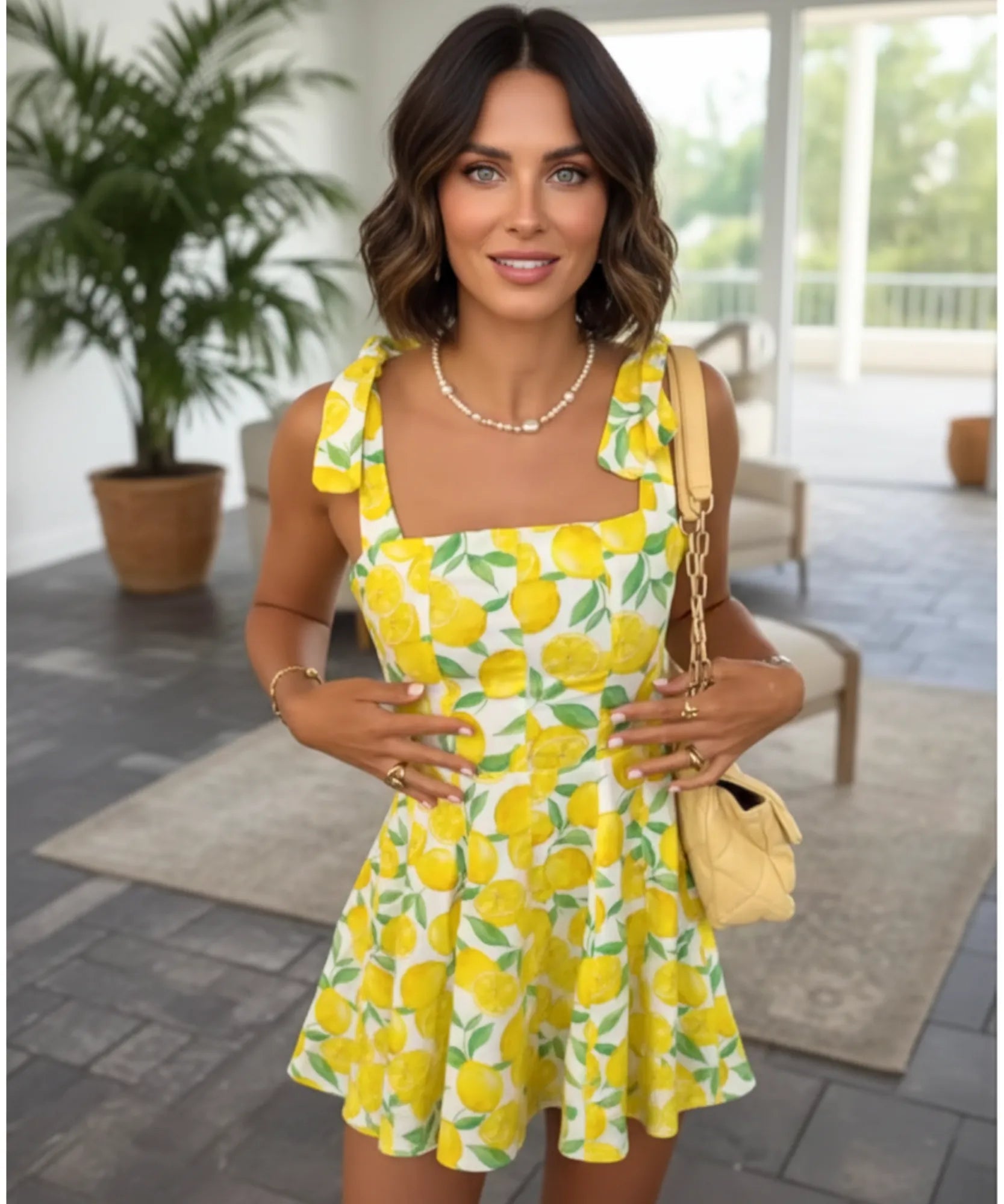 Women's boho mini dress in yellow fruit print, side view