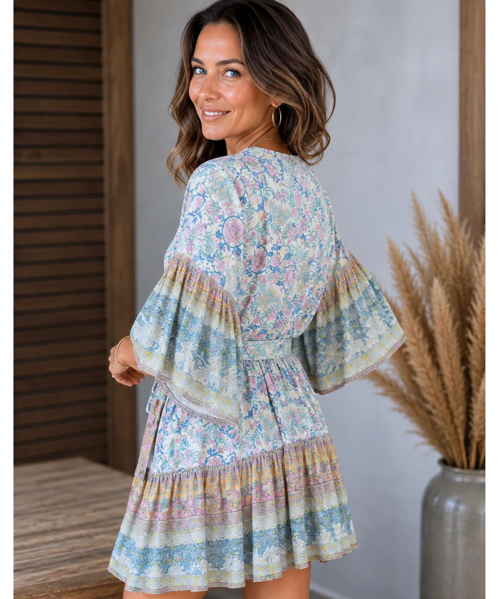 Boho floral mini dress, back view with bell sleeves