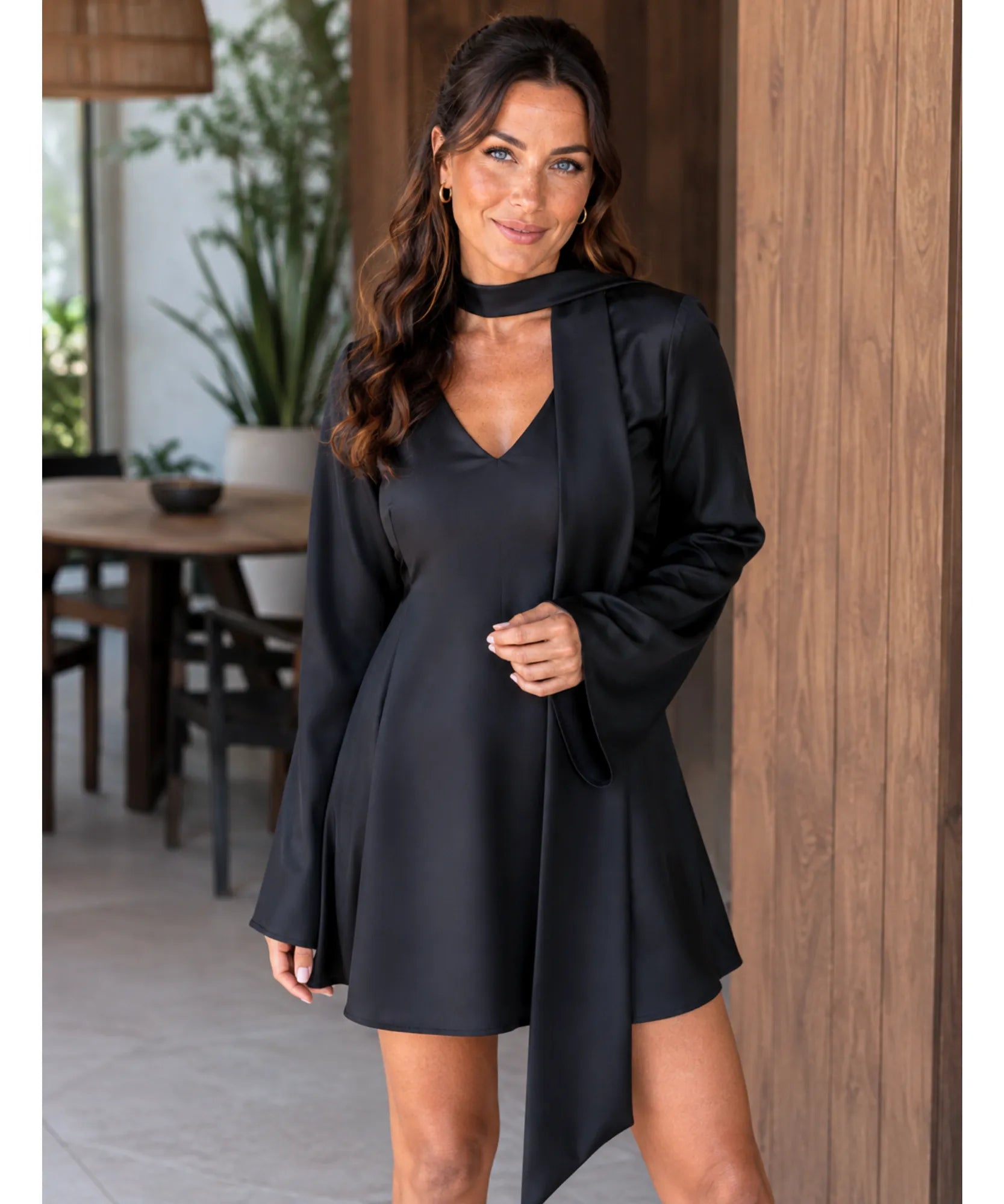 Black satin mini dress with bell sleeves, front view