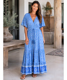 Cornflower blue boho maxi dress with orange border, front view