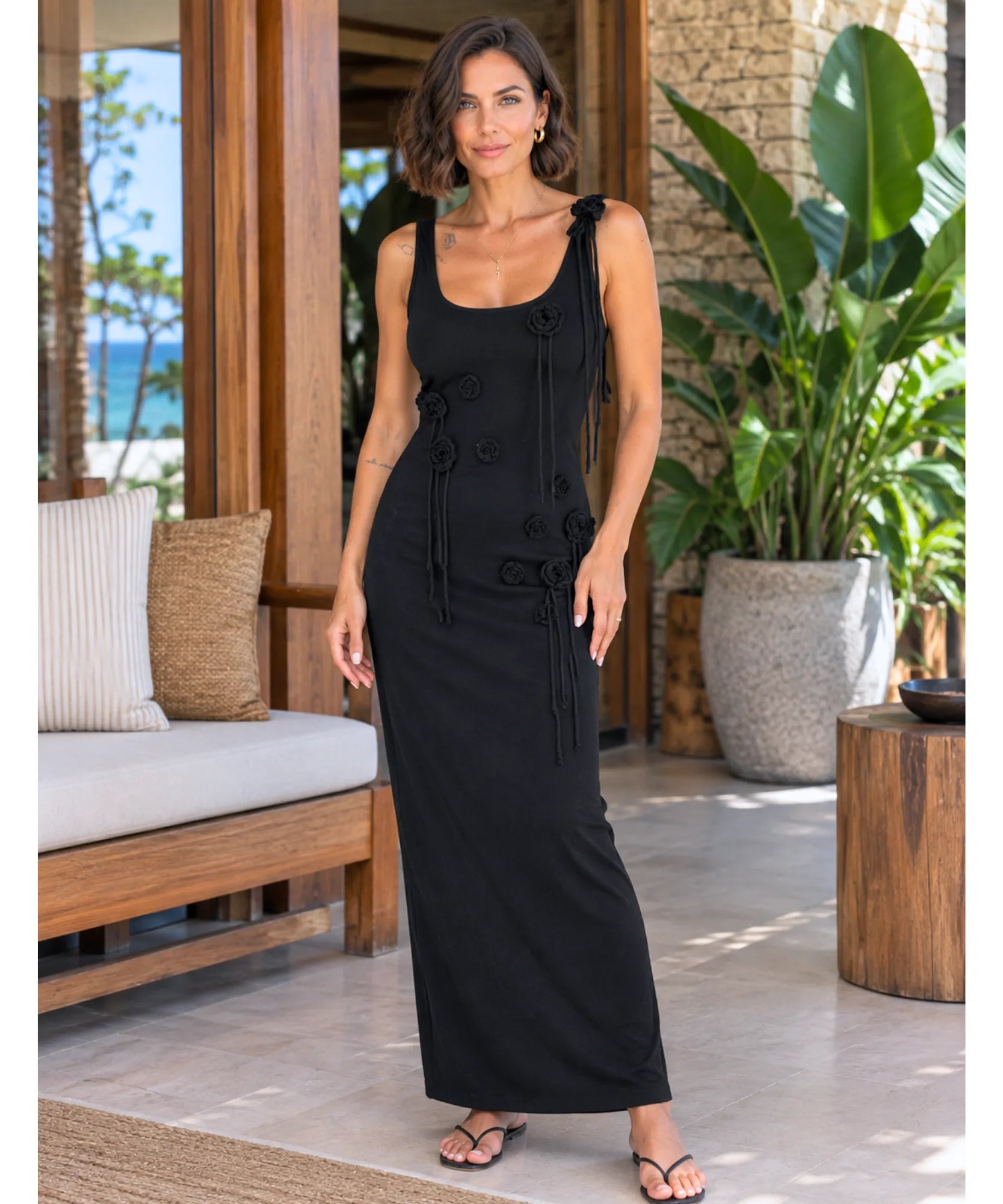 Black ribbed knit maxi dress with 3D flowers, front view