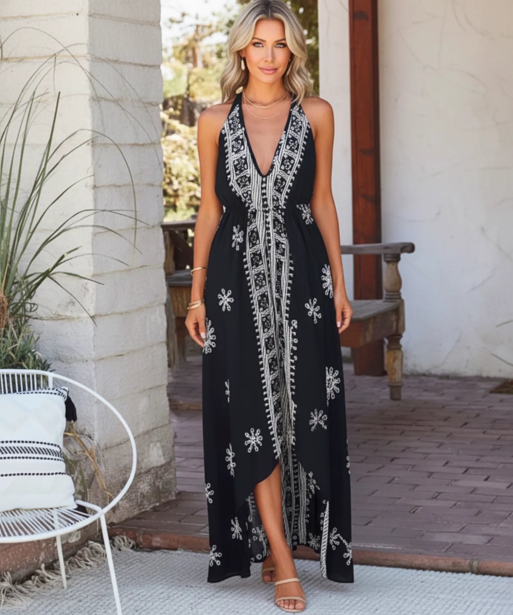 Women's boho halter maxi dress in black print, front view