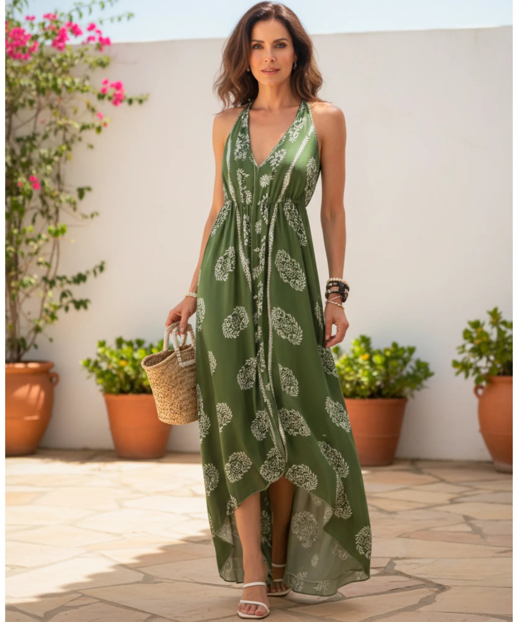 Women's boho halter maxi dress in green print, front view