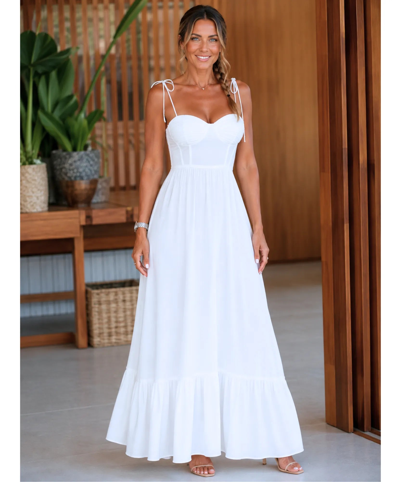 White bustier maxi dress, flowing skirt in motion