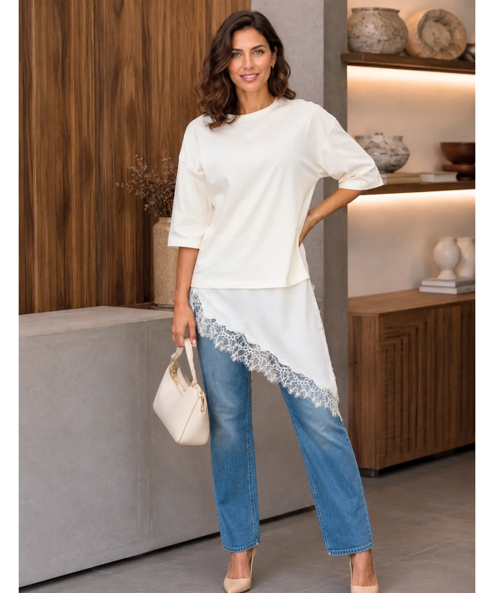 Ivory oversized t-shirt dress with lace hem, styled with jeans