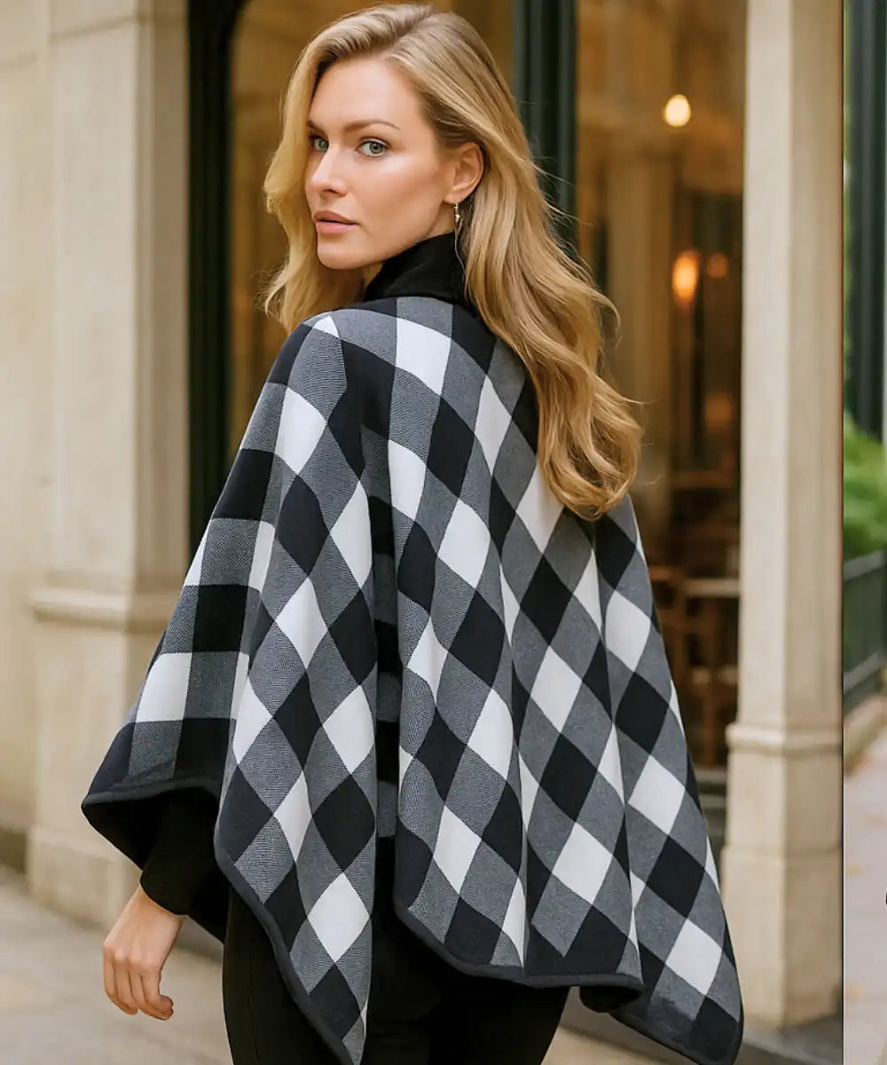Women's plaid blanket poncho in black plaid, back view